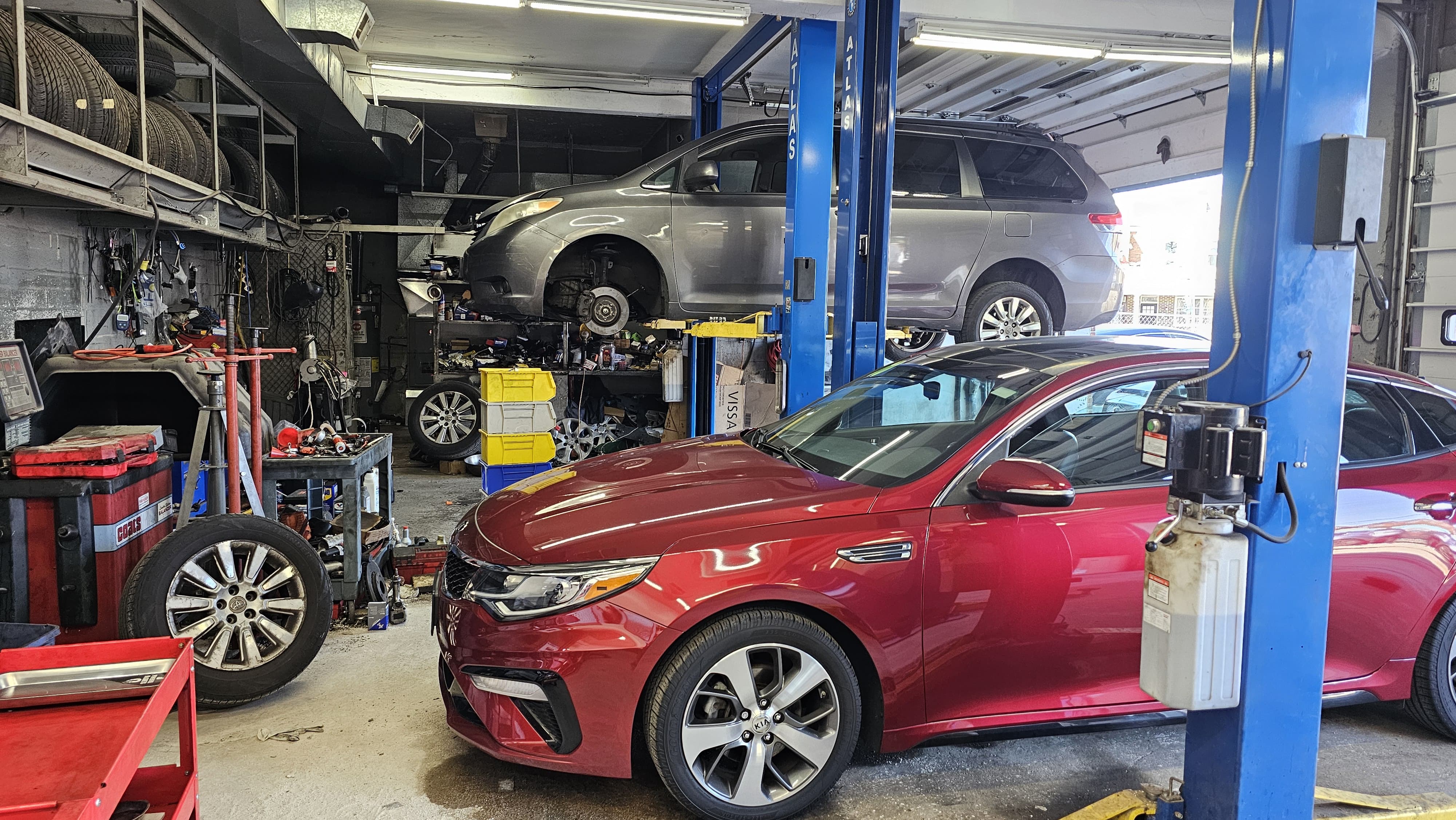 Auto Zoom LLC shop interior with lift